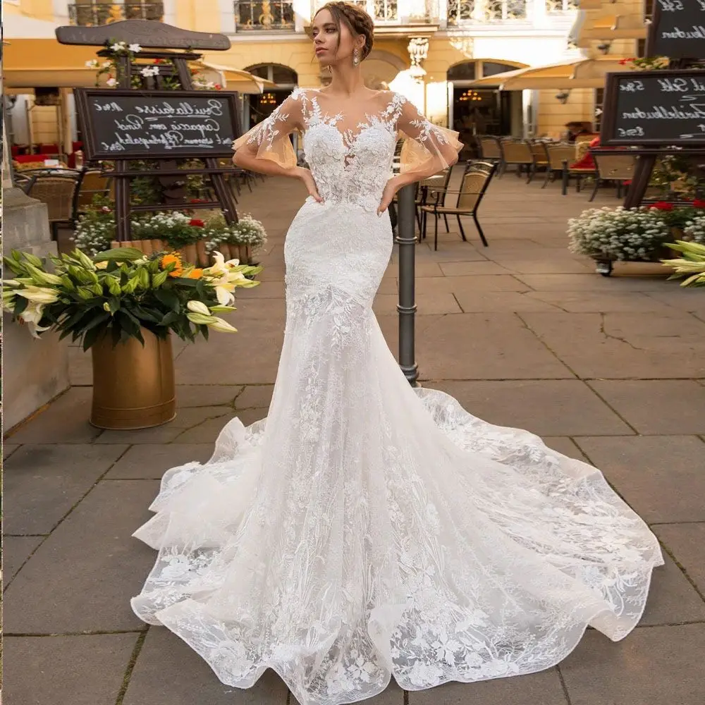Robe De брак романтичное кружевное платье с кружевной аппликацией и коротким рукавом с низким вырезом на спине свадебное платье кожи Тюль Руса...
Robe De брак романтичное кружевное платье с кружевной аппликацией и коротким рукавом с низким вырезом на спине свадебное платье кожи Тюль Руса...
