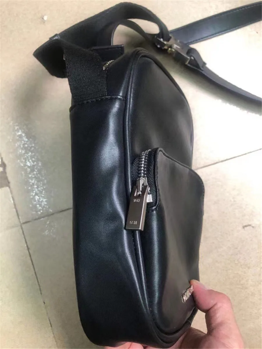 New Arrived Black Leather ALYX Men Women Bag Metal Button Double handles 1017 ALYX 9SM Backpack 
New Arrived Black Leather ALYX Men Women Bag Metal Button Double handles 1017 ALYX 9SM Backpack