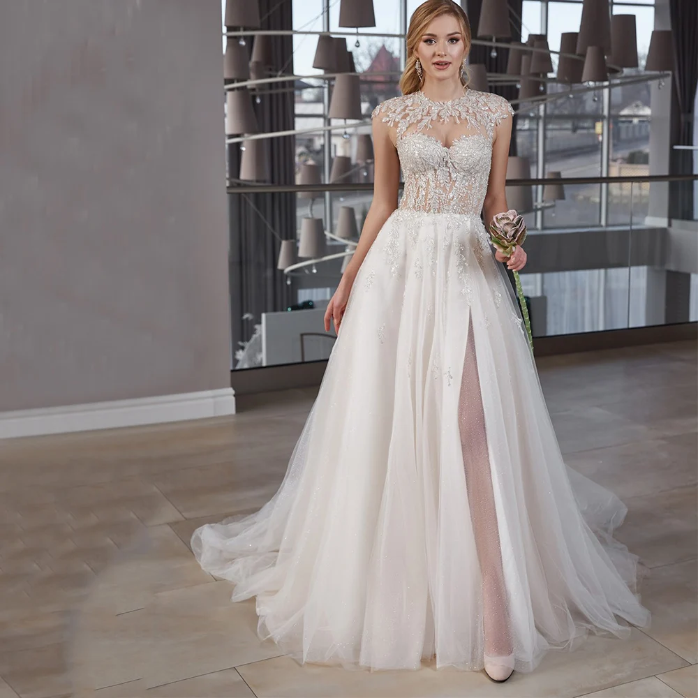 Vestido De Noiva Tule A Line Front Slit O Neck Wedding Dresses Applique Sparkle Lace Up Encaje Sin Mangas suknia ślubna
Vestido De Noiva Tule A Line Front Slit O Neck Wedding Dresses Applique Sparkle Lace Up Encaje Sin Mangas suknia ślubna