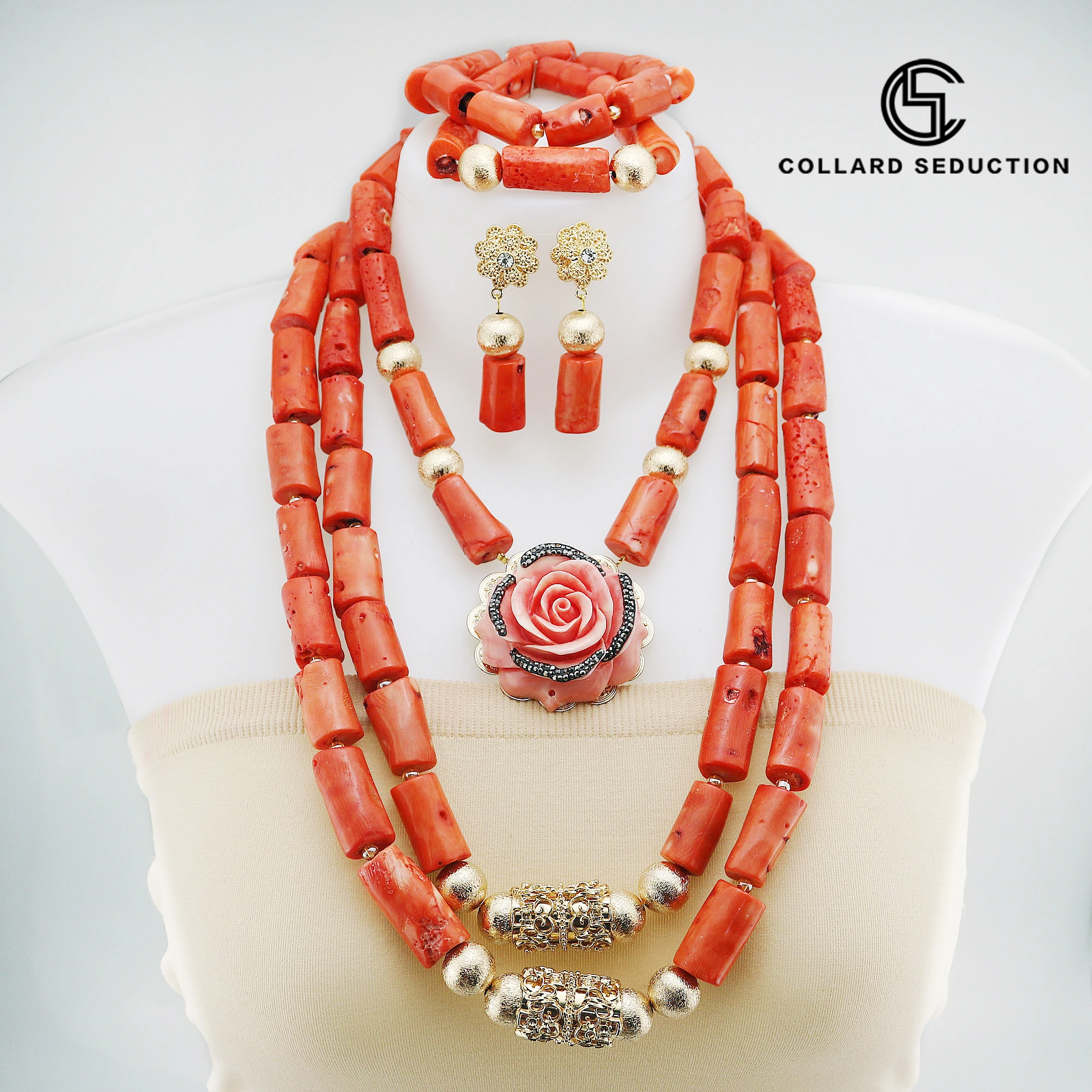 Комплект из колье, серёг и браслета, из искусственного кораллового материала
Комплект из колье, серёг и браслета, из искусственного кораллового материала