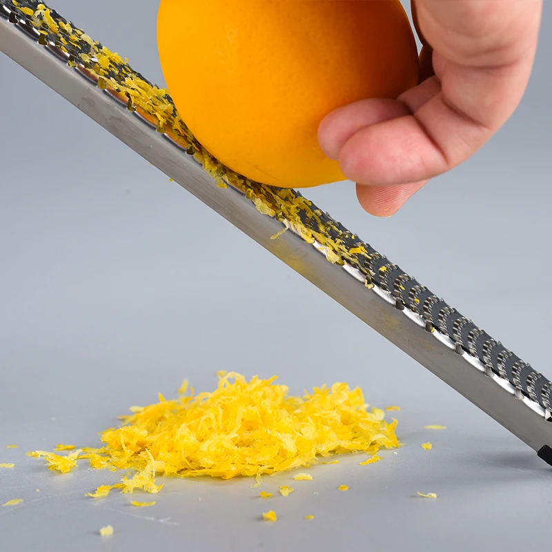 Stainless Steel Cheese Grater Lemon Fruit Chocolate Butter Zester Non-Slip Handle Fruit Grater Kitchen Gadget
Stainless Steel Cheese Grater Lemon Fruit Chocolate Butter Zester Non-Slip Handle Fruit Grater Kitchen Gadget