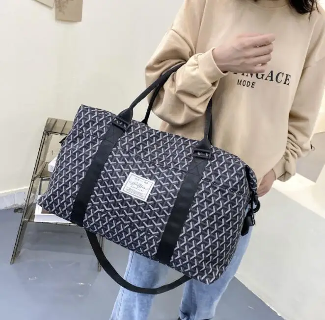 Travel bag large capacity luggage storage bag travel bag female hand raised poor luggage bag waterproof one-shoulder messenger b
Travel bag large capacity luggage storage bag travel bag female hand raised poor luggage bag waterproof one-shoulder messenger b
