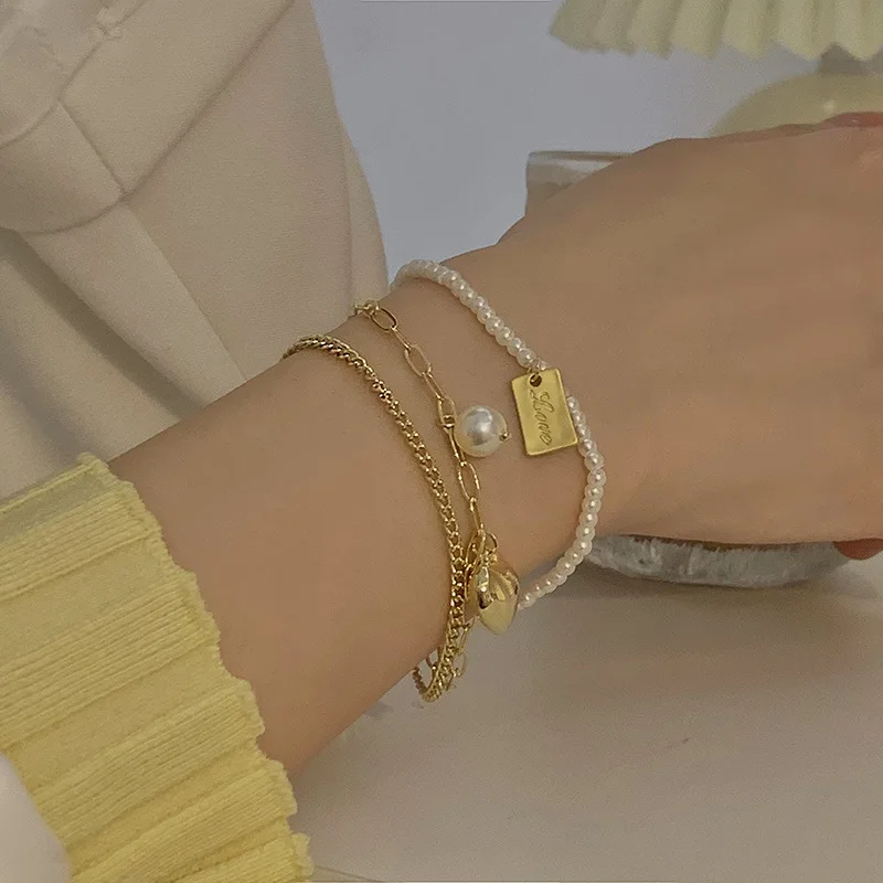 Korean fashion simple personality chain pearl love multi-layer bracelet for ladies hand ornaments
Korean fashion simple personality chain pearl love multi-layer bracelet for ladies hand ornaments