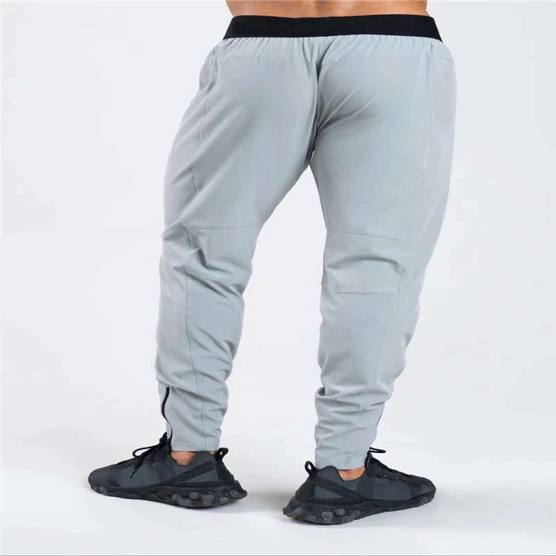 Cross-border muscle brothers stretch slim sports trousers men's new fitness exercise running zipper trousers
Cross-border muscle brothers stretch slim sports trousers men's new fitness exercise running zipper trousers
