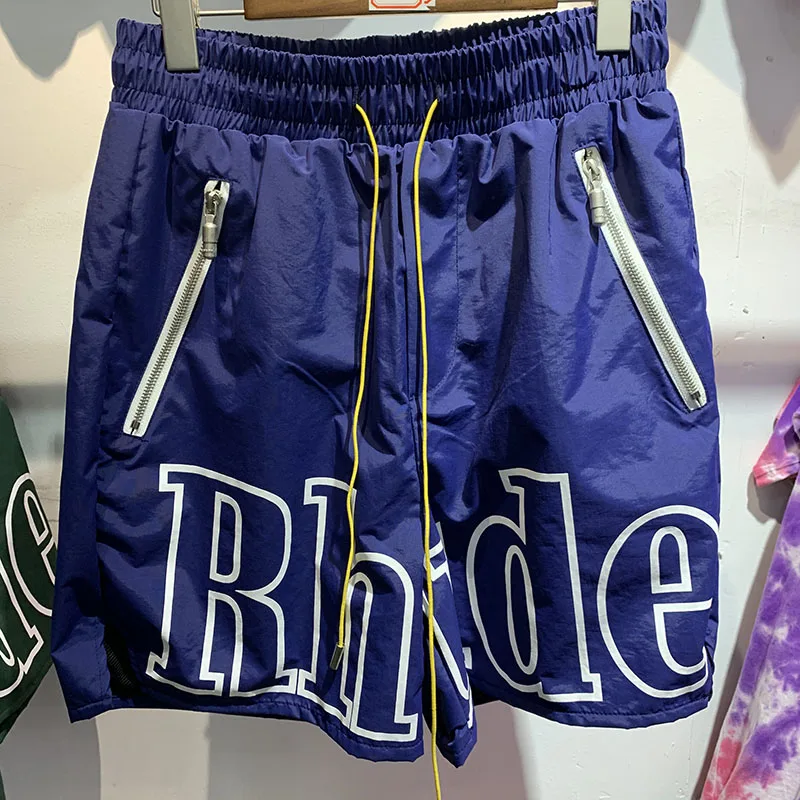 Oversize RHUDE Shorts Men Women High Quality White Letter Print Rhude RH Logo Pill Zipper Pockets Breeches 
Oversize RHUDE Shorts Men Women High Quality White Letter Print Rhude RH Logo Pill Zipper Pockets Breeches
