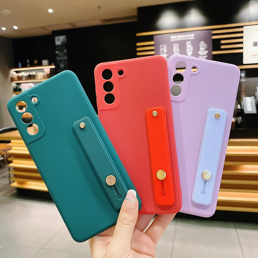 Wrist Strap Soft Silicone Case For Samsung Galaxy S21 S10 Plus S20 FE A32 A12 A71 A81 A11 A02 A91 Note20 Pro 10 Plus Stand Cover
Wrist Strap Soft Silicone Case For Samsung Galaxy S21 S10 Plus S20 FE A32 A12 A71 A81 A11 A02 A91 Note20 Pro 10 Plus Stand Cover