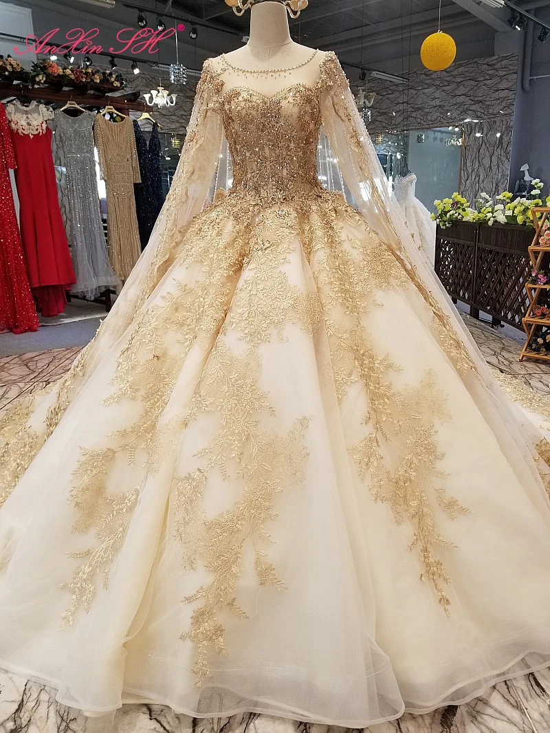 AnXin SH Luxury princess golden lace o neck beading crystal illusion long sleeves with veil sparkly wedding dress 100%real photo
AnXin SH Luxury princess golden lace o neck beading crystal illusion long sleeves with veil sparkly wedding dress 100%real photo