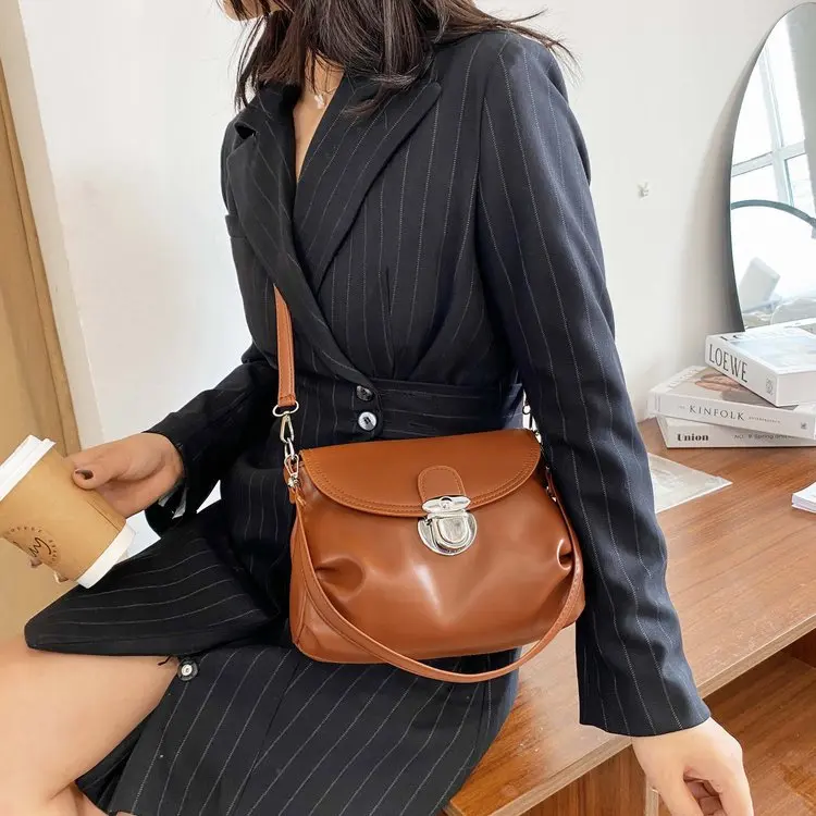 2021 New Simple PU Leather Lock Bag Fold Bag Shoulder Slung Portable PU Shoulder Bag Women's Bag Purses and Handbags 
2021 New Simple PU Leather Lock Bag Fold Bag Shoulder Slung Portable PU Shoulder Bag Women's Bag Purses and Handbags