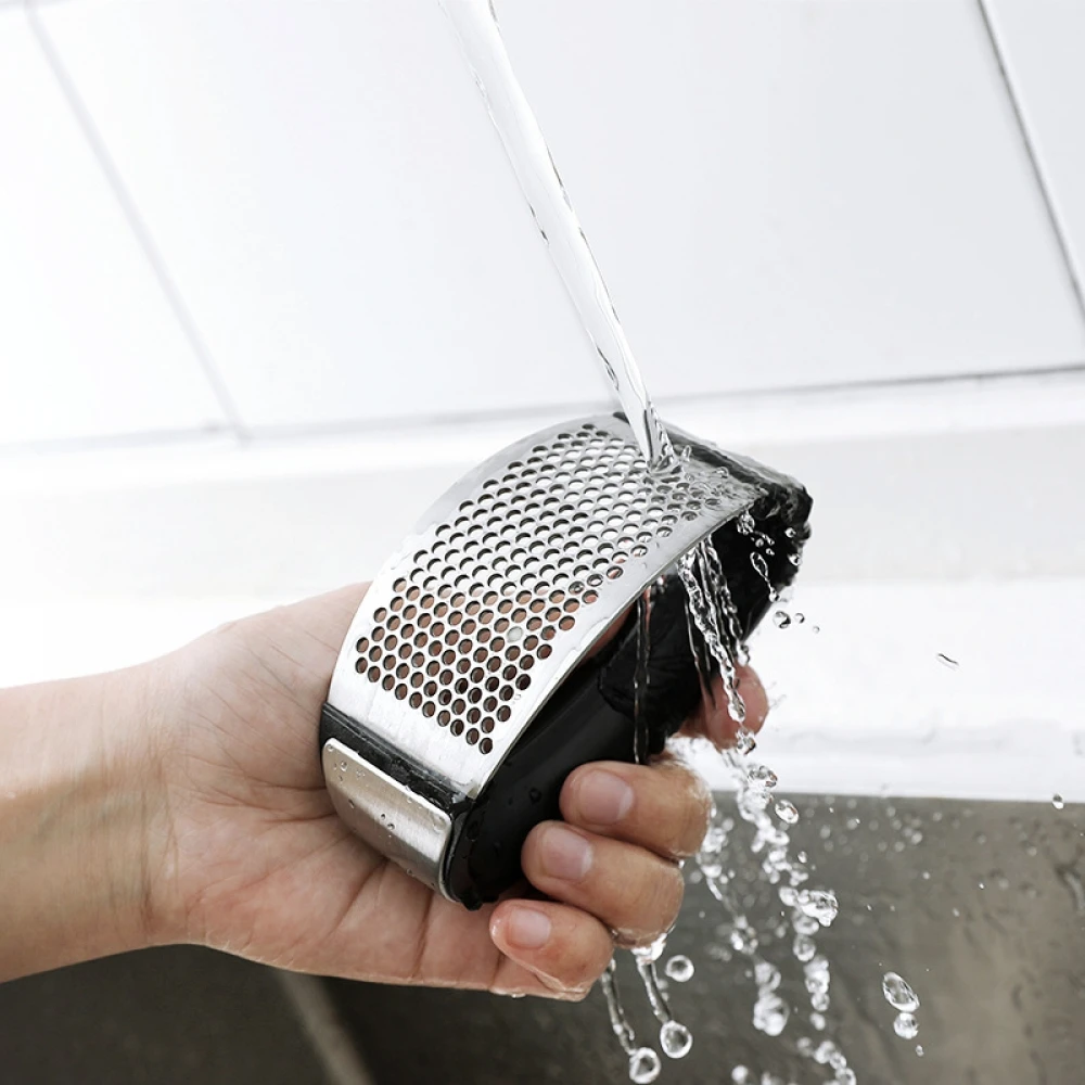 Stainless Steel Manual Arc Garlic Press Multifunctional Garlic Masher Garlic Twister Kitchen Garlic Grinder Kitchen Tool
Stainless Steel Manual Arc Garlic Press Multifunctional Garlic Masher Garlic Twister Kitchen Garlic Grinder Kitchen Tool