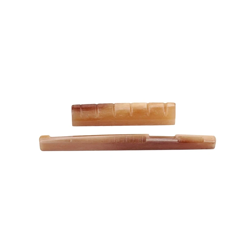2Pcs/Set Bone Guitar Bridge Saddle and Nut for Folk Acoustic Guitar Replacement Parts
2Pcs/Set Bone Guitar Bridge Saddle and Nut for Folk Acoustic Guitar Replacement Parts