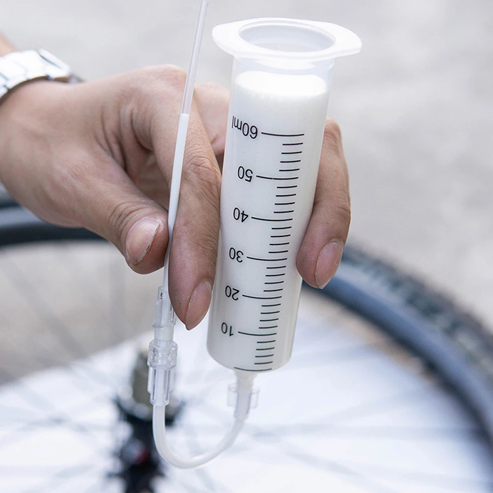 Bicycle tire fluid injection tool Tubeless Tyre Sealant Injector MTB Bike Bicycle Cycling Tire Filling Tool
Bicycle tire fluid injection tool Tubeless Tyre Sealant Injector MTB Bike Bicycle Cycling Tire Filling Tool