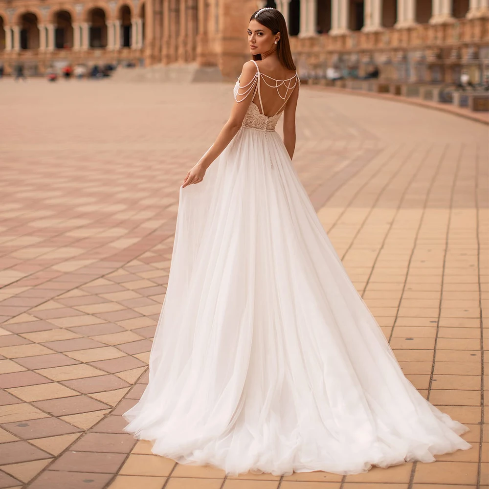 Elegant Wedding Dresses Tulle Illusion Lace Appliques Beading V-Neck Spaghetti Straps Backless Ball Bridal Gowns
Elegant Wedding Dresses Tulle Illusion Lace Appliques Beading V-Neck Spaghetti Straps Backless Ball Bridal Gowns