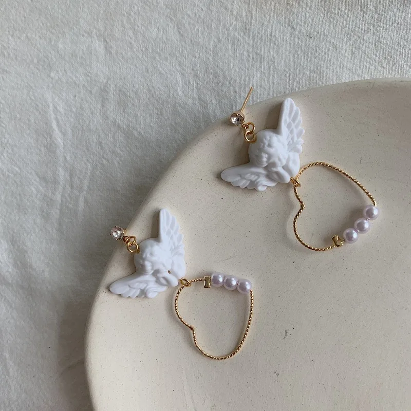 Kpop Creative Harajuku Cute Cupid Angel Pendant Drop Earring Heart With Pearl Aesthetic Chic Jewelry For Cool Women Egirl Gift
Kpop Creative Harajuku Cute Cupid Angel Pendant Drop Earring Heart With Pearl Aesthetic Chic Jewelry For Cool Women Egirl Gift