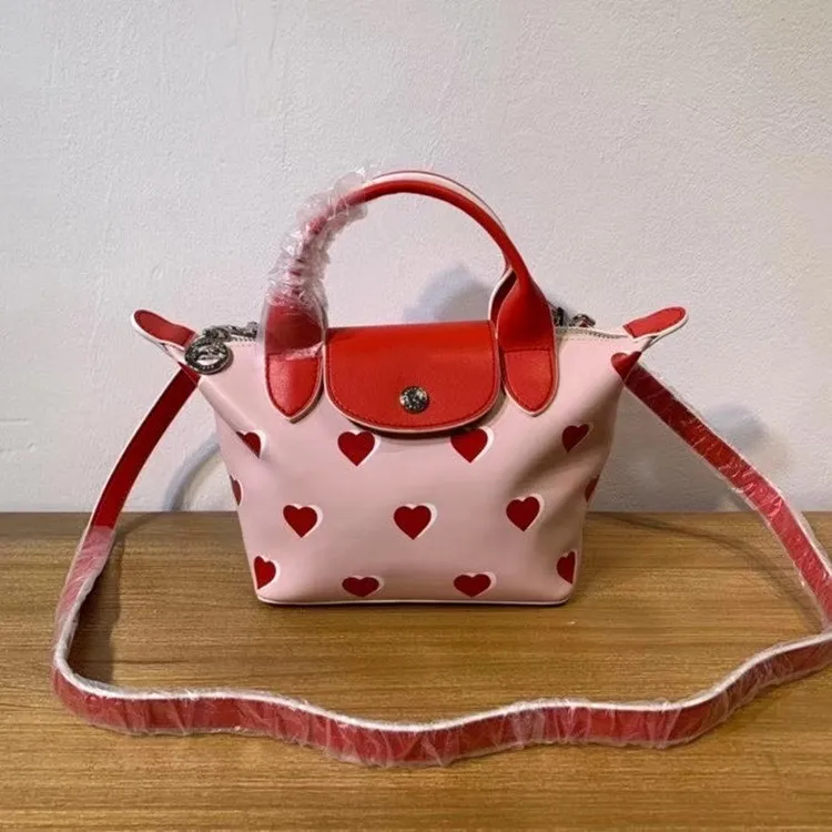 New limited edition pink love sheepskin dumpling bag female mini handbag messenger bag shoulder bag
New limited edition pink love sheepskin dumpling bag female mini handbag messenger bag shoulder bag