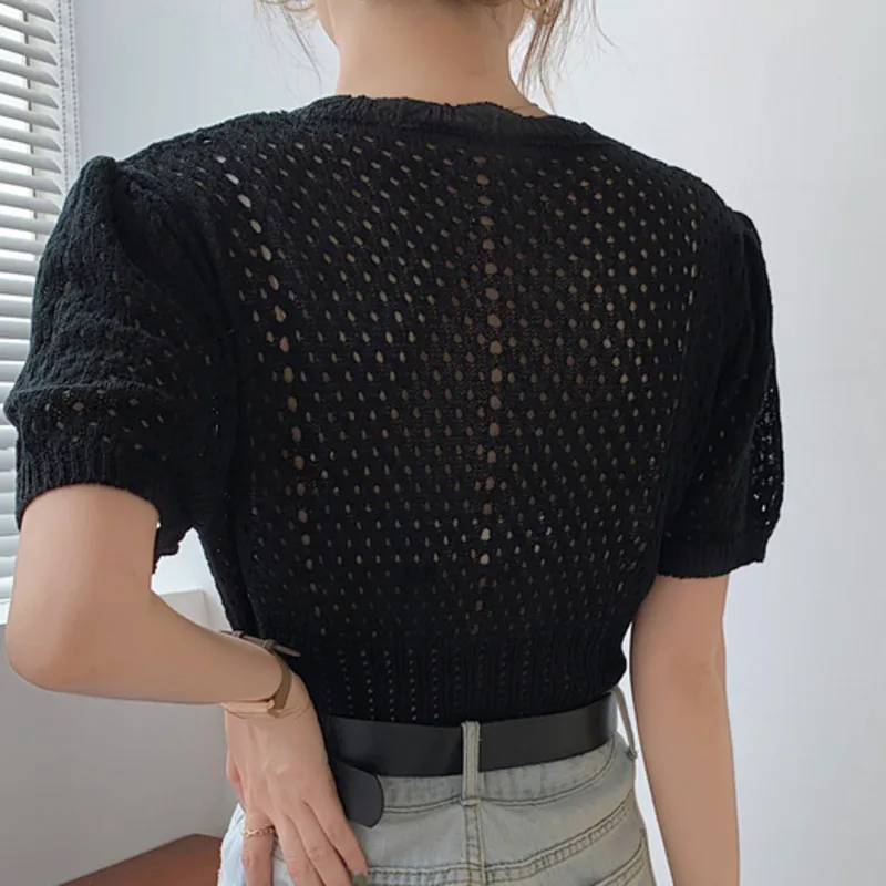 Women Clothing 2021 Summer Korean Vintage V-Neck Single-Breasted Loose Female Bubble Sleeve Hollow Out Knitted Cardigans Tops
Women Clothing 2021 Summer Korean Vintage V-Neck Single-Breasted Loose Female Bubble Sleeve Hollow Out Knitted Cardigans Tops