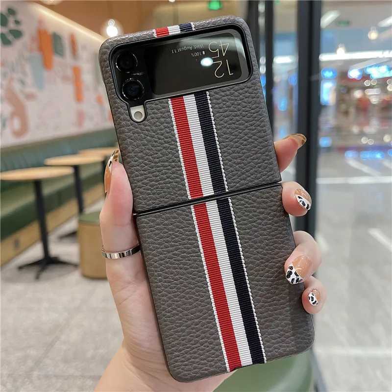 2022 Fashion Stripe Litchi Grain Cross Case for Samsung Galaxy Z Flip 4 3 Cover Anti-knock luxury leather Cases for Flip 3 Flip3
2022 Fashion Stripe Litchi Grain Cross Case for Samsung Galaxy Z Flip 4 3 Cover Anti-knock luxury leather Cases for Flip 3 Flip3