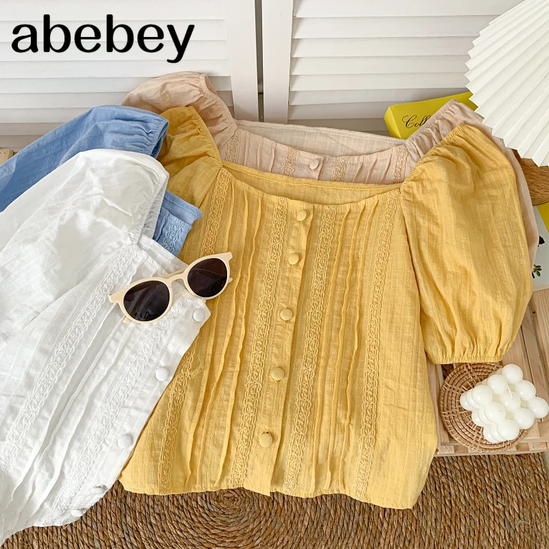 Korean square collar puff sleeve Shirt lace patchwork single breasted high waist pleated short Shirt Top 2021 New Summer
Korean square collar puff sleeve Shirt lace patchwork single breasted high waist pleated short Shirt Top 2021 New Summer