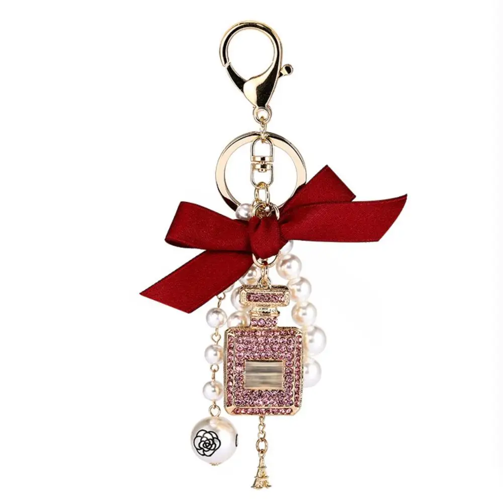 Fashion Perfume Bottle Keychain Bow Ribbon Cute Car keyring Grace White Pearl Bag Charms Beautiful Pendant For Lady Women
Fashion Perfume Bottle Keychain Bow Ribbon Cute Car keyring Grace White Pearl Bag Charms Beautiful Pendant For Lady Women