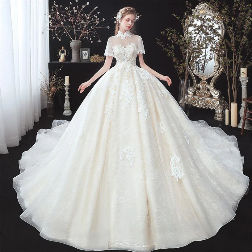 High Neck Short Sleeves Beautiful Lace Appliques Luxury New Wedding Dresses Puffy Skirt Royal Train Ball Gown Plus Sizes 2021
High Neck Short Sleeves Beautiful Lace Appliques Luxury New Wedding Dresses Puffy Skirt Royal Train Ball Gown Plus Sizes 2021