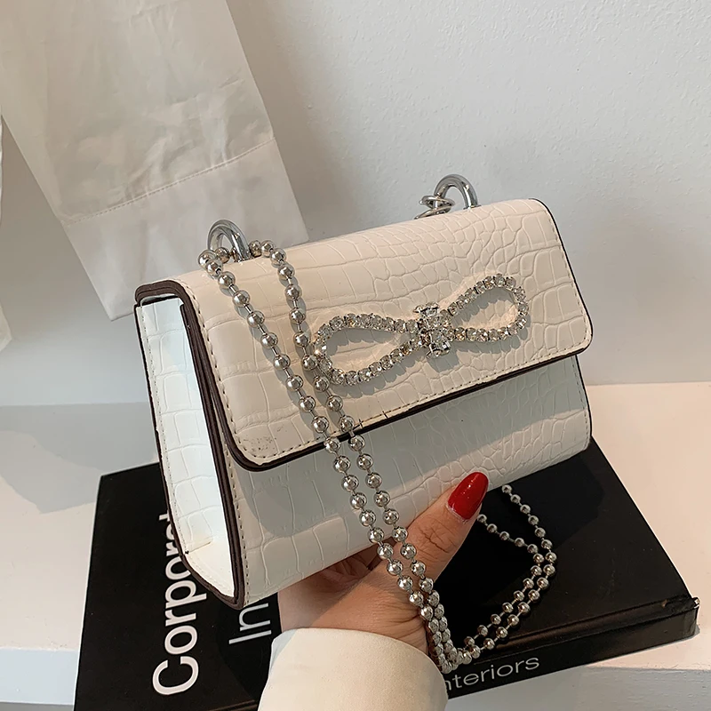 2021 new fashion beaded chain shoulder bag summer exotic joker slung small square bag high sense bag
2021 new fashion beaded chain shoulder bag summer exotic joker slung small square bag high sense bag