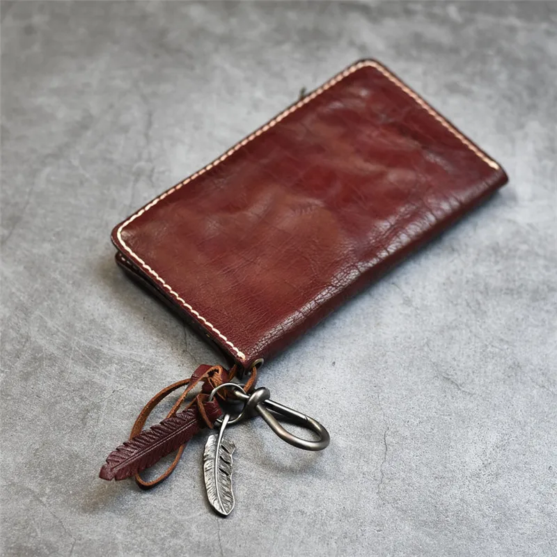 Retro ethnic women's genuine leather wallet the first layer of leather simple charm vertical wine red long wallet passport set 
Retro ethnic women's genuine leather wallet the first layer of leather simple charm vertical wine red long wallet passport set