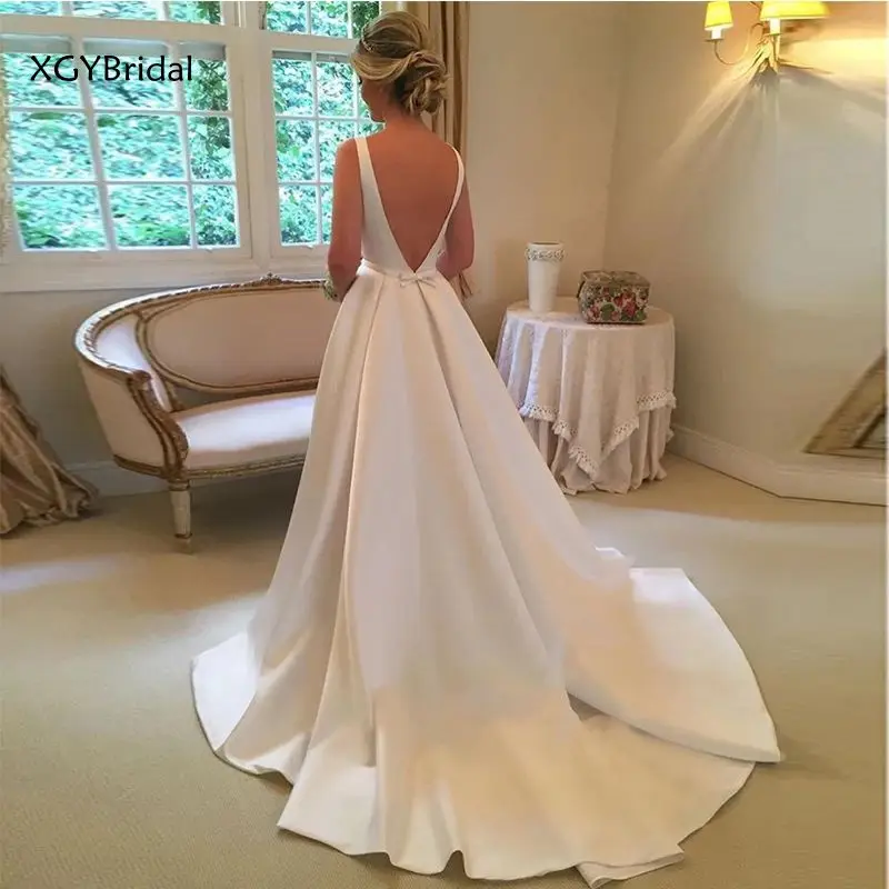 New Arrival Elegant A Line Backless Wedding Dresses Sleeveless White Ivory Satin Bridal Dress Custom Made Vestido de Casamento
New Arrival Elegant A Line Backless Wedding Dresses Sleeveless White Ivory Satin Bridal Dress Custom Made Vestido de Casamento