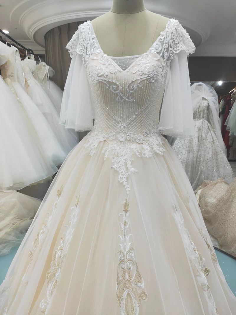 Champagne V-Neck Puff Sleeve Backless Beading Lace Bride Gown Wedding Dress for Clearance
Champagne V-Neck Puff Sleeve Backless Beading Lace Bride Gown Wedding Dress for Clearance