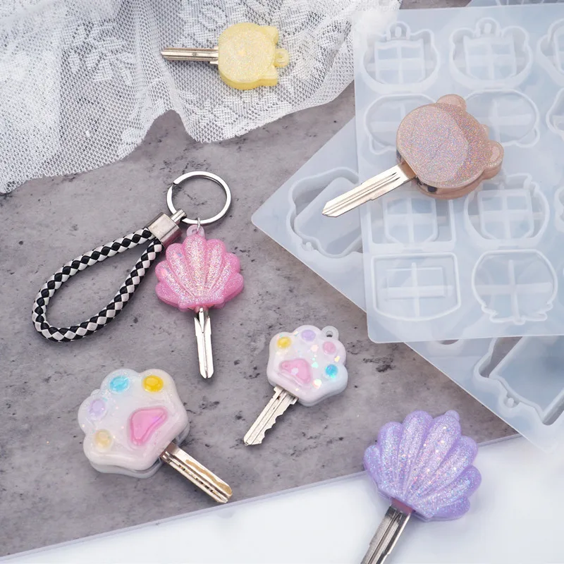 DIY epoxy resin key head mold with hole Cartoon cat paw crystal epoxy keychain key cover silicone mold Chocolate fudge mold
DIY epoxy resin key head mold with hole Cartoon cat paw crystal epoxy keychain key cover silicone mold Chocolate fudge mold