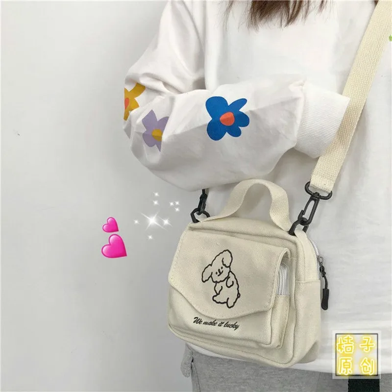Ladies Fashion Canvas Small Square Bag Korean Version Multifunctional Cute Dog One-shoulder Diagonal Mobile Phone Package
Ladies Fashion Canvas Small Square Bag Korean Version Multifunctional Cute Dog One-shoulder Diagonal Mobile Phone Package