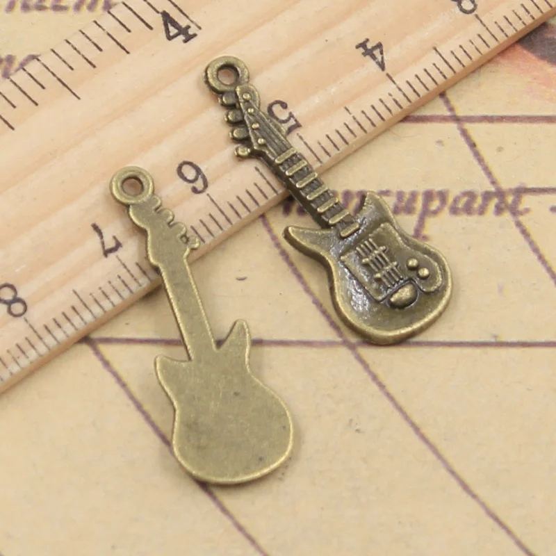 15pcs Charms Electic Guitar 35x12mm Tibetan Bronze Silver Color Pendants Antique Jewelry Making DIY Handmade Craft For Necklace 
15pcs Charms Electic Guitar 35x12mm Tibetan Bronze Silver Color Pendants Antique Jewelry Making DIY Handmade Craft For Necklace