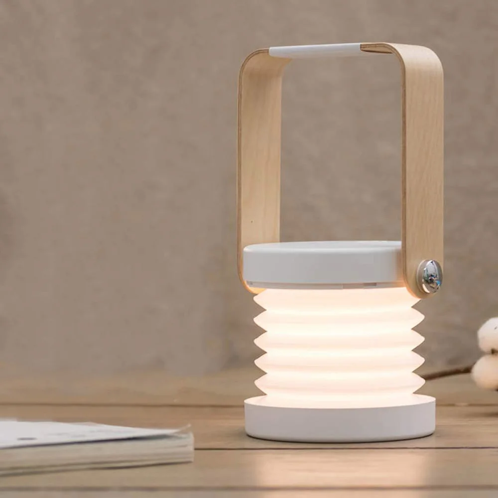 Creative wooden handle portable lantern lamp telescopic folding led table lamp charging night light reading lamp
Creative wooden handle portable lantern lamp telescopic folding led table lamp charging night light reading lamp