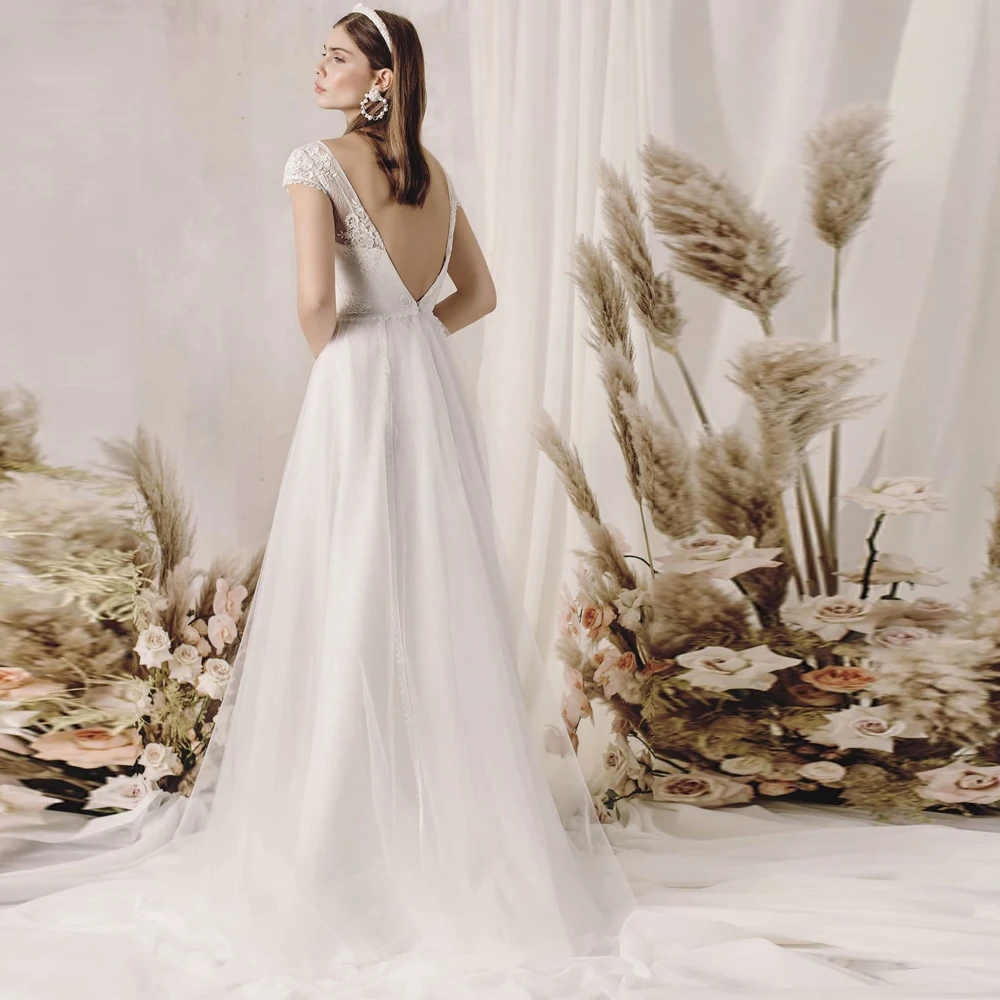 Vestidos Elegant Wedding Dresses Tulle Illusion Appliques Lace Bateau Short Sleeve Backless Ball Bridal Gowns
Vestidos Elegant Wedding Dresses Tulle Illusion Appliques Lace Bateau Short Sleeve Backless Ball Bridal Gowns