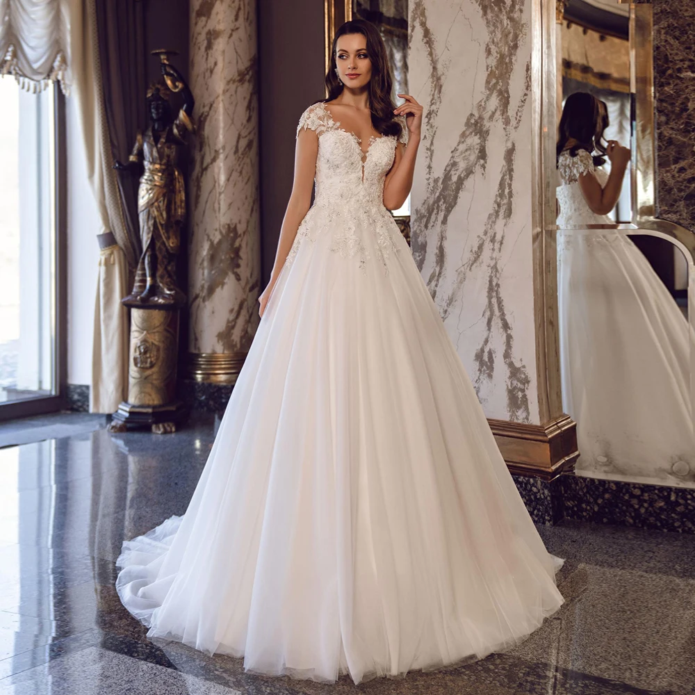 Gorgeous Wedding Dress 2021 Scoop Neck Cap Sleeve Beading Pearls Lace Applqiues Tulle A Line Sweep Train Bridal Dresses
Gorgeous Wedding Dress 2021 Scoop Neck Cap Sleeve Beading Pearls Lace Applqiues Tulle A Line Sweep Train Bridal Dresses