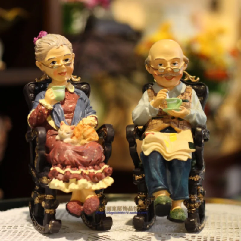 Grandpa and grandma rocking chair grandmother put a wedding souvenir on the table decorative pieces sculptures room
Grandpa and grandma rocking chair grandmother put a wedding souvenir on the table decorative pieces sculptures room