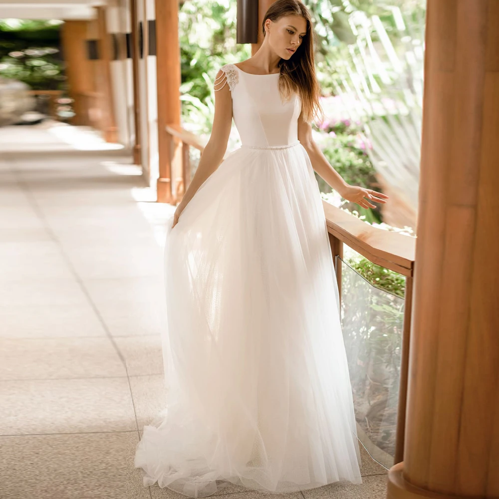 Vestidos Elegant Wedding Dresses Tulle Illusion Appliques Beading Bateau Sleeveless Backless Ball Bridal Gowns
Vestidos Elegant Wedding Dresses Tulle Illusion Appliques Beading Bateau Sleeveless Backless Ball Bridal Gowns