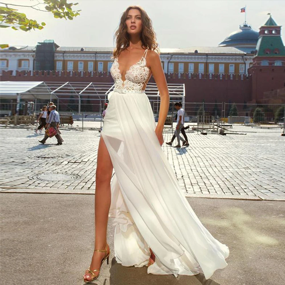 2021 Sexy Spaghetti Straps Wedding Dresses V Neck Open Back Lace A Line Chiffon Sweep Train Beach Bridal Gowns
2021 Sexy Spaghetti Straps Wedding Dresses V Neck Open Back Lace A Line Chiffon Sweep Train Beach Bridal Gowns