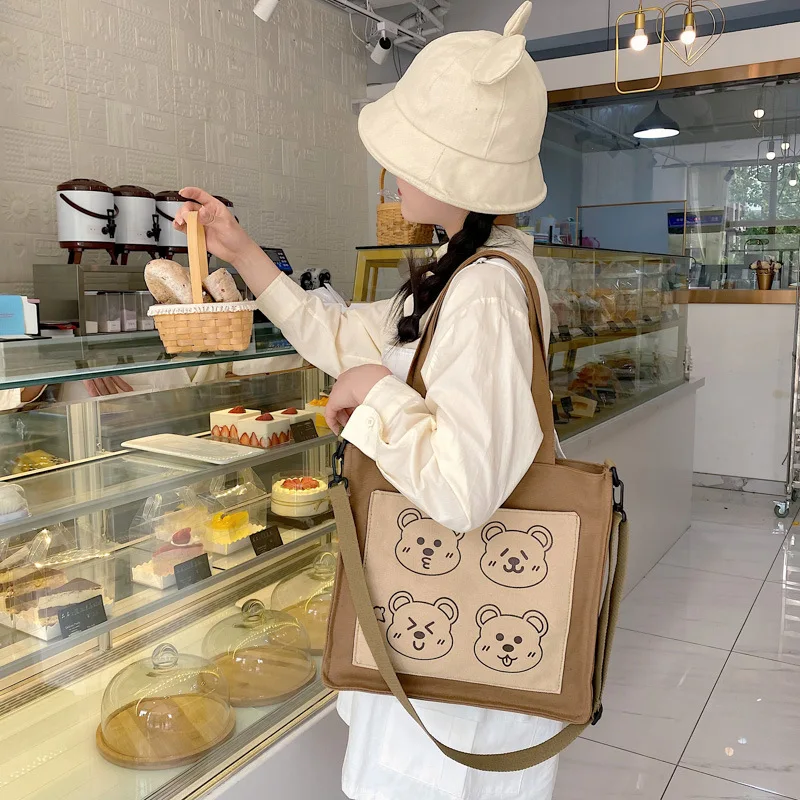 Japanese ins cute Women funny personality handbag bear sister student canvas shoulder bag
Japanese ins cute Women funny personality handbag bear sister student canvas shoulder bag