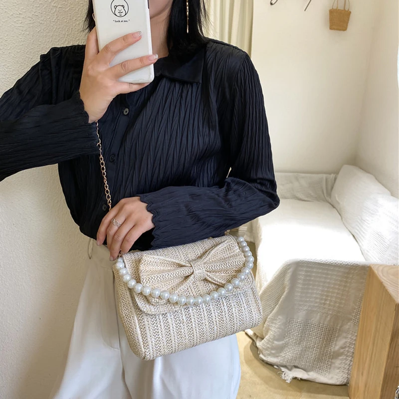 SEKUSE Bow knitted women evening bags with beaded chain handbags cover rattan female summer beach purse bags
SEKUSE Bow knitted women evening bags with beaded chain handbags cover rattan female summer beach purse bags