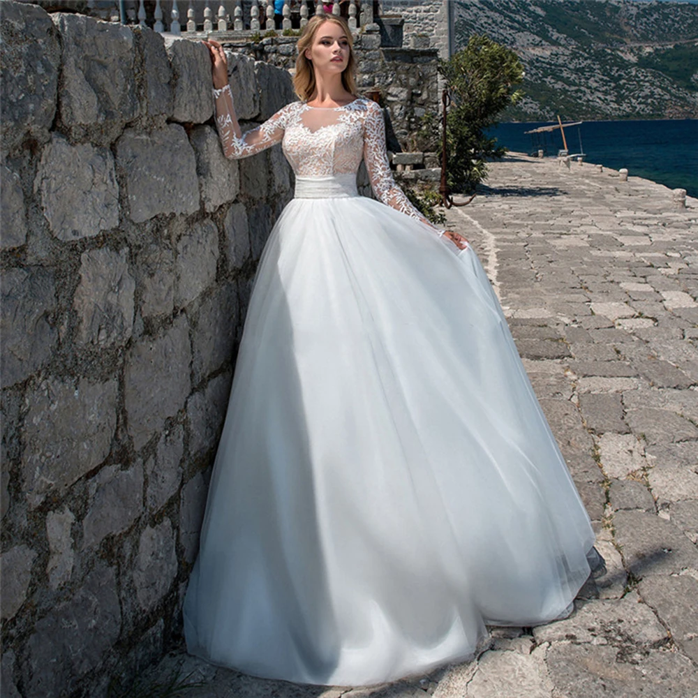 Champanes White Appliques Wedding Dress 2020 Long Sleeves Puffy Tulle Bridal Dresses Plus Size Custom Made H297
Champanes White Appliques Wedding Dress 2020 Long Sleeves Puffy Tulle Bridal Dresses Plus Size Custom Made H297