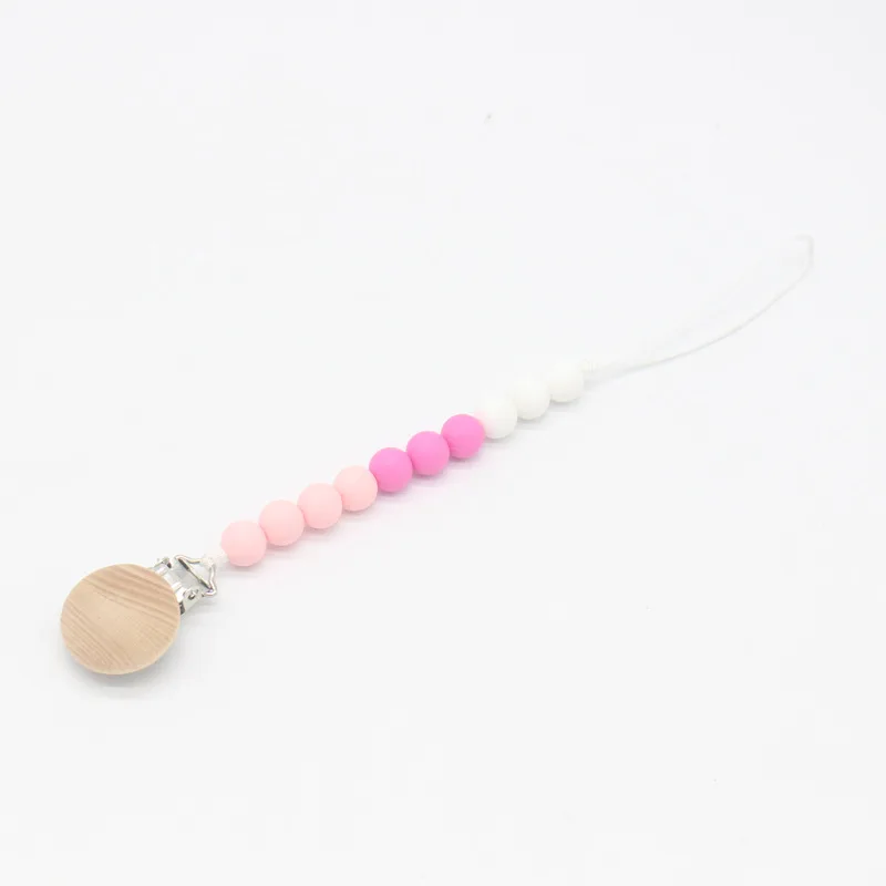 Wood Pacifier Clip Silicone Beads Dummy Clip Holder Cute Pacifier Clips Soother Chains Baby Teething Toy for Baby Chew
Wood Pacifier Clip Silicone Beads Dummy Clip Holder Cute Pacifier Clips Soother Chains Baby Teething Toy for Baby Chew