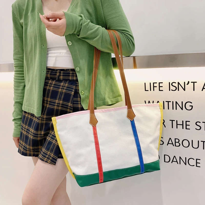 New Canvas Women's Shoulder Bag Trendy Large-capacity Color Matching Shopping Bag Letter Printing Zipper Handbags for Women 2021
New Canvas Women's Shoulder Bag Trendy Large-capacity Color Matching Shopping Bag Letter Printing Zipper Handbags for Women 2021