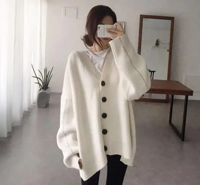 2021 autumn fashion handmade dotted loose wild sweater pure color single row button knitted sweater cardigan jacket women
2021 autumn fashion handmade dotted loose wild sweater pure color single row button knitted sweater cardigan jacket women