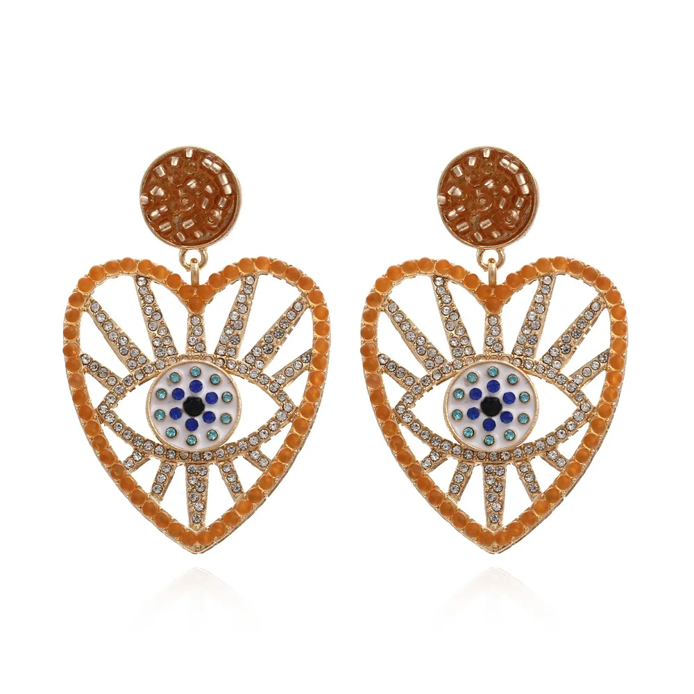 European and American beads heart-shaped eye earrings retro alloy diamond devil's eye earrings personalized earrings women. 
European and American beads heart-shaped eye earrings retro alloy diamond devil's eye earrings personalized earrings women.