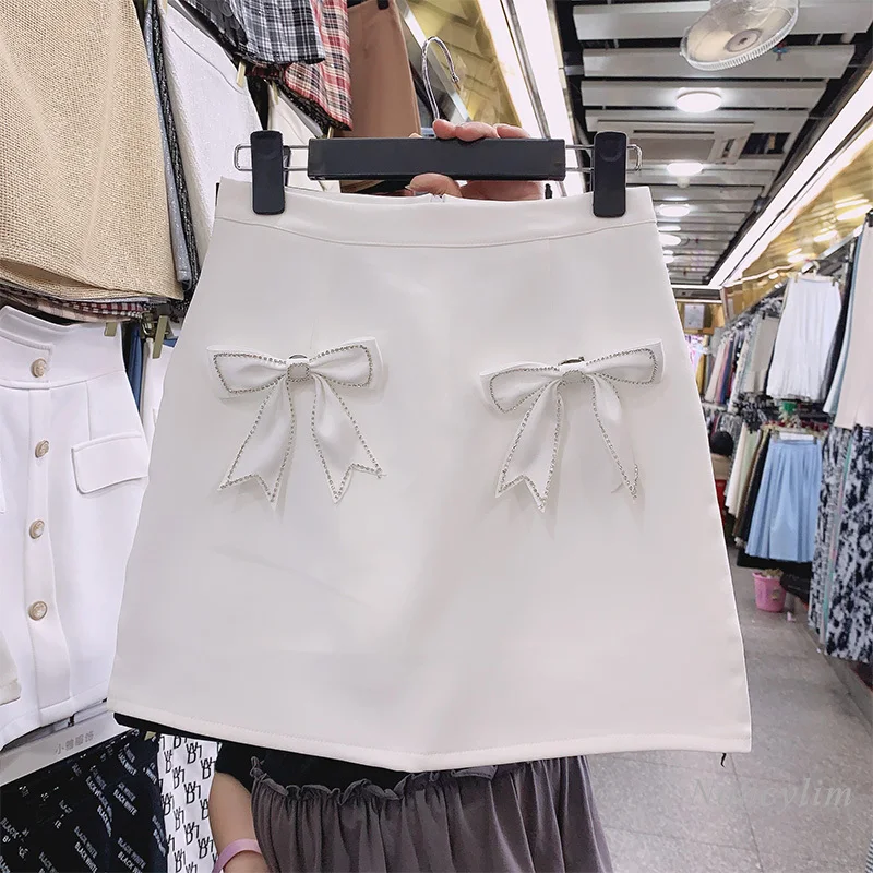 Mini Skirts Womens Spring and Summer Temperament New Korean Style High Waist Slimming Bow Design A- Line Skirt Femme 2021
Mini Skirts Womens Spring and Summer Temperament New Korean Style High Waist Slimming Bow Design A- Line Skirt Femme 2021