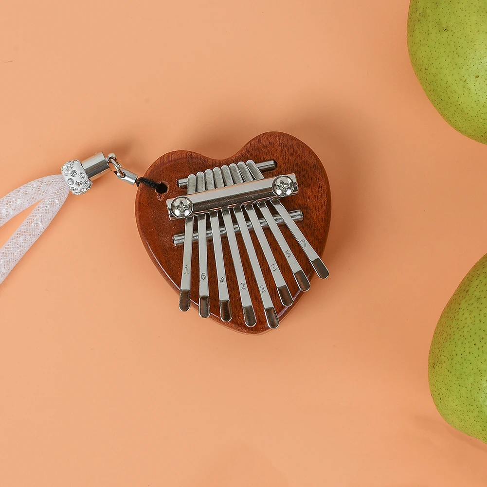 Мини-калимба в форме сердца Mbira Sanza пианино для большого пальца со шнурком музыкальный инструмент для детей и взрослых подарки для новичков
Мини-калимба в форме сердца Mbira Sanza пианино для большого пальца со шнурком музыкальный инструмент для детей и взрослых подарки для новичков