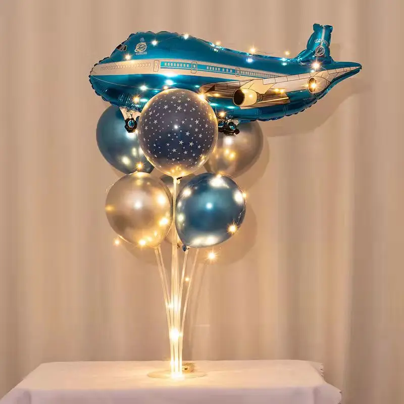 Boy space theme birthday party light table of floating children age balloon tree ornament scene layout
Boy space theme birthday party light table of floating children age balloon tree ornament scene layout