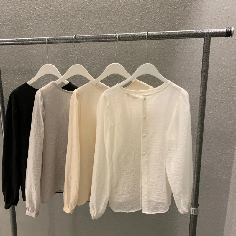 Kimotimo Summer Women Tops Korean Chic Elegant Design O Neck Shirts Loose Back Button Transparent All-match Long Sleeve Blouses 
Kimotimo Summer Women Tops Korean Chic Elegant Design O Neck Shirts Loose Back Button Transparent All-match Long Sleeve Blouses