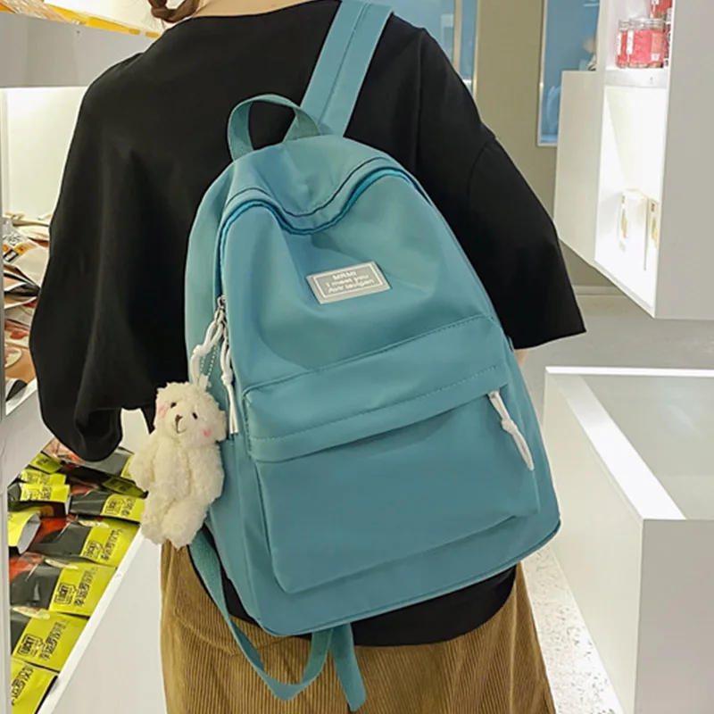 EST Solid Color Kawaii Pendant Letters Waterproof Nylon Backpack Girls Casual Rucksack Women Schoolbag Mochila Mujer Travel Bags
EST Solid Color Kawaii Pendant Letters Waterproof Nylon Backpack Girls Casual Rucksack Women Schoolbag Mochila Mujer Travel Bags
