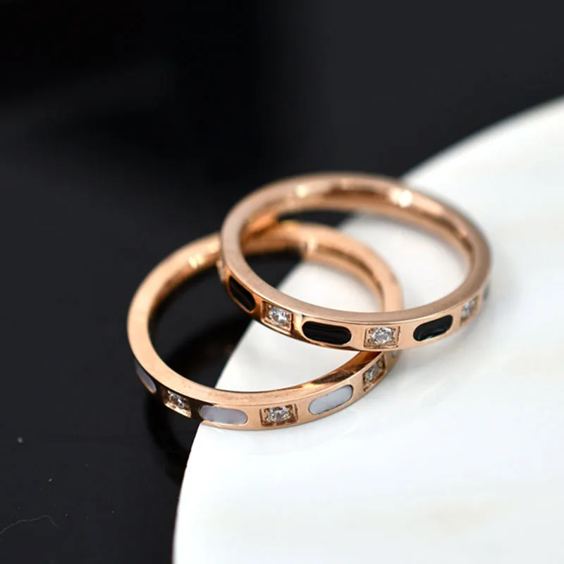 Simple titanium steel ring female black and white shell diamond niche design light luxury couple ring
Simple titanium steel ring female black and white shell diamond niche design light luxury couple ring