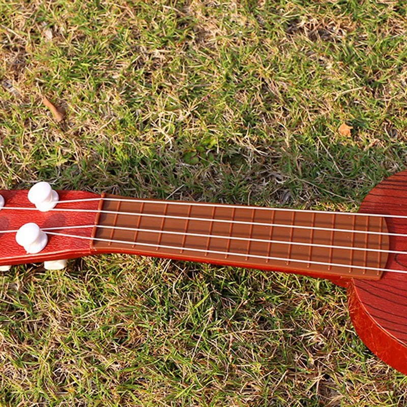 Mini Ukulele Guitar Toy for Kids, 4 Strings Children Musical Instruments Christmas Gift
Mini Ukulele Guitar Toy for Kids, 4 Strings Children Musical Instruments Christmas Gift